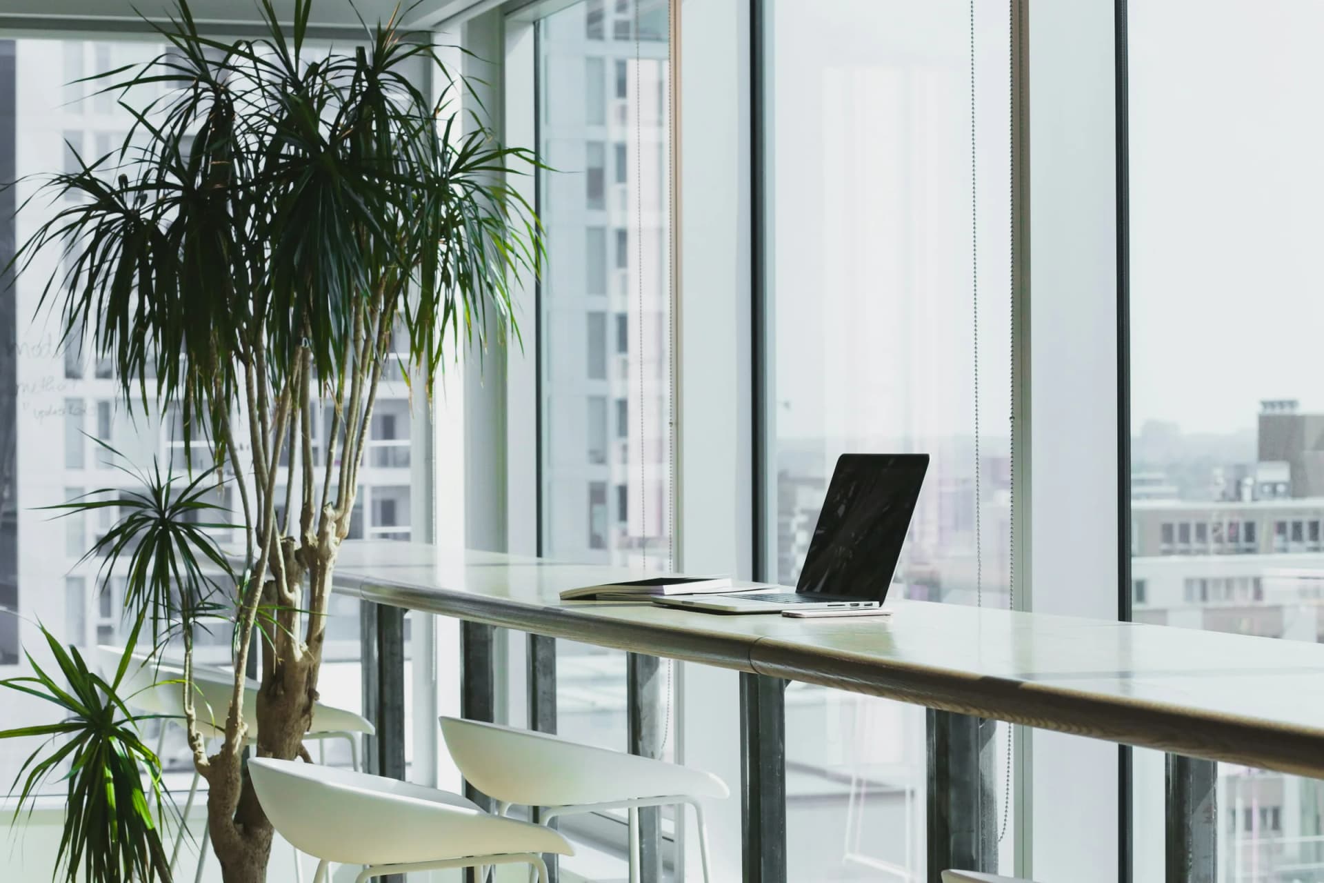 A quiet workspace beside a window overlooking a city